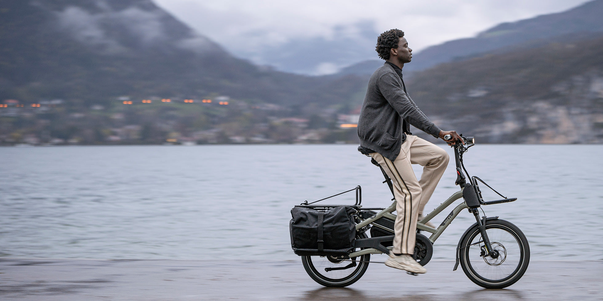 Man riding Tern HSD cargo e-bike along waterfront