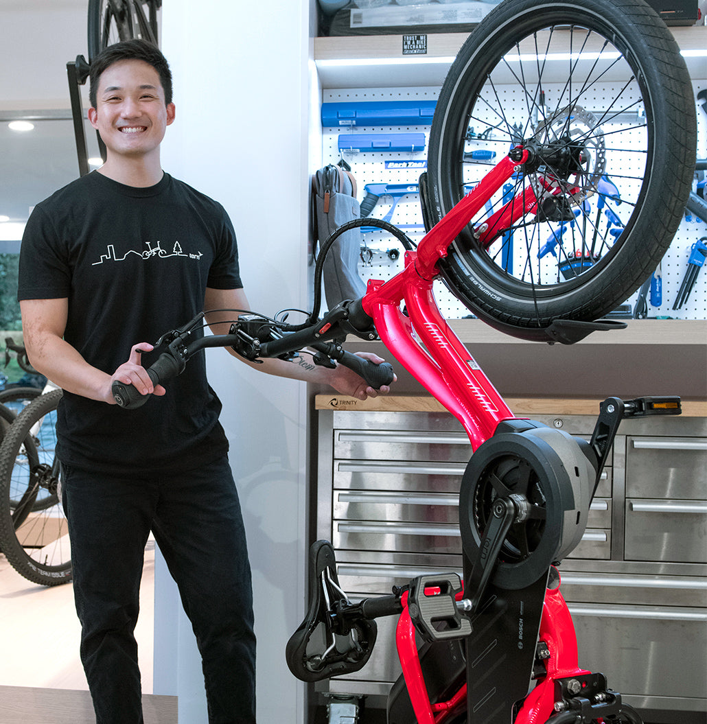 Man with Tern NBD e-bike stood vertically