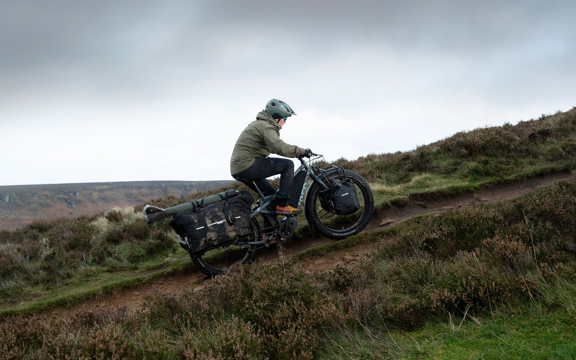 Man riding uphill on Tern Orox