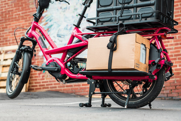 Loaded Tern cargo e-bike with racks and kickstand