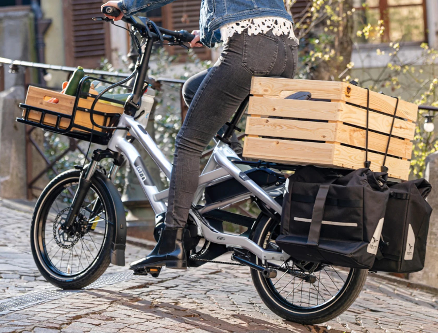 Woman riding Airstream Special Edition Silver Tern HSD Electric Cargo Bike