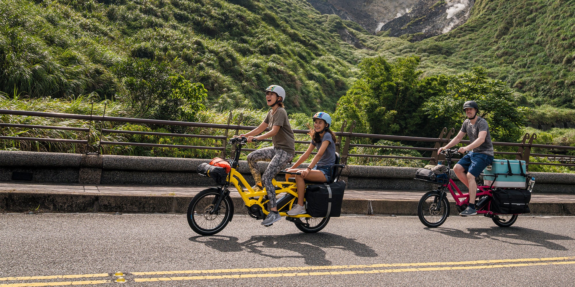 Family riding Tern GSD cargo e-bikes