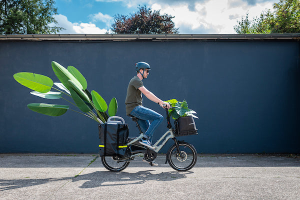 Man riding Tern cargo e-bike loaded with plants