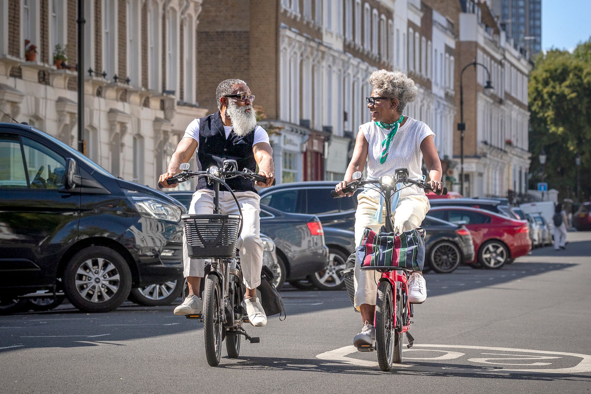 Couple riding Tern NBD e-bikes