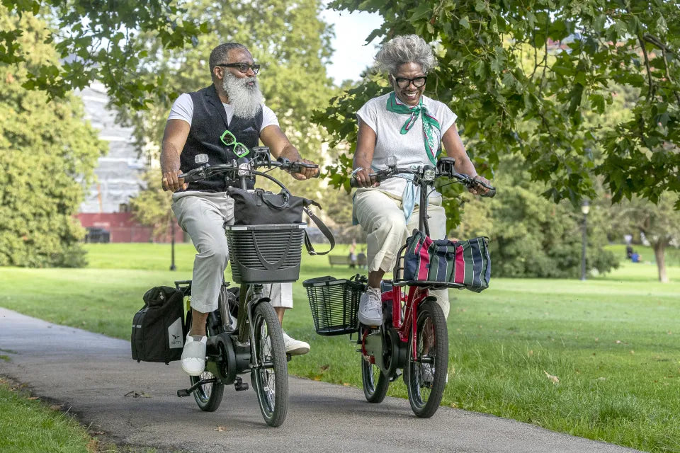 Couple riding Tern NBD e-bikes